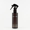 Levetem body exfoliating spray bottle on a light-grey background