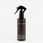 Levetem body exfoliating spray bottle on a light-grey background